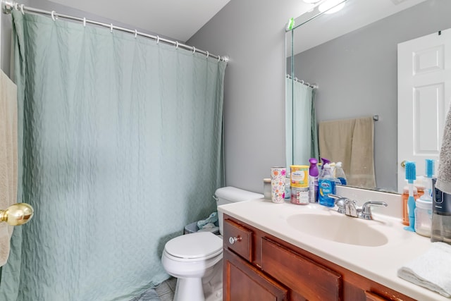 full bathroom with vanity and toilet