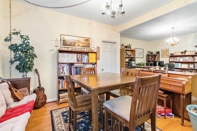 dining area featuring a chandelier and light wood-style floors