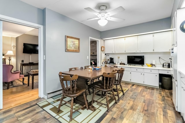 dining area with ceiling fan and light wood-style floors