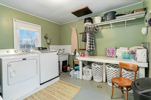 clothes washing area featuring laundry area and washer and dryer