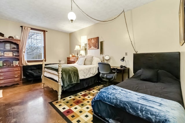 bedroom featuring finished concrete floors