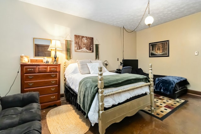 bedroom featuring concrete flooring