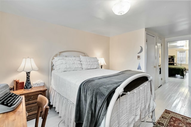 bedroom with light wood-style floors