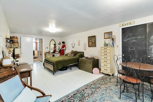 bedroom featuring wood finished floors