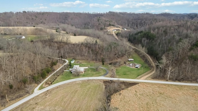 aerial view featuring a wooded view