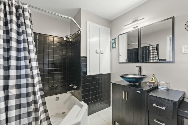 bathroom featuring shower / bathtub combination with curtain, tile walls, and vanity