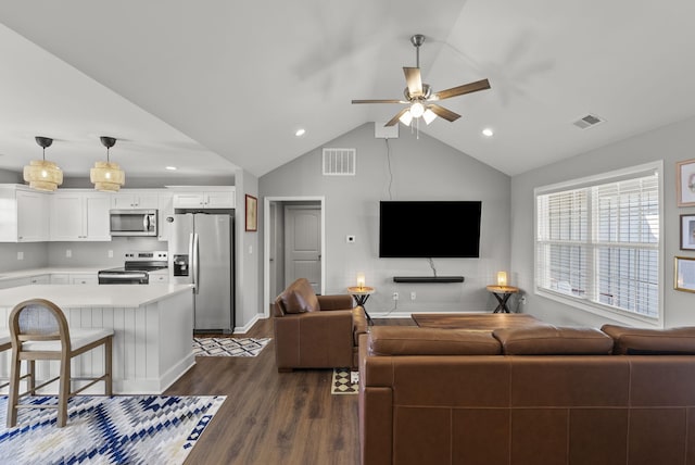 living room featuring baseboards, visible vents, vaulted ceiling, and dark wood-style flooring