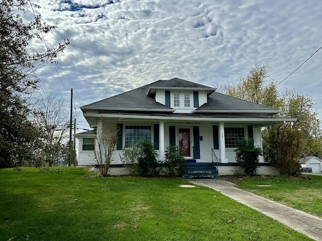 bungalow-style home with a porch and a front yard