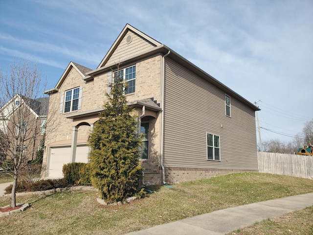 view of home's exterior with a garage, a yard, brick siding, and fence