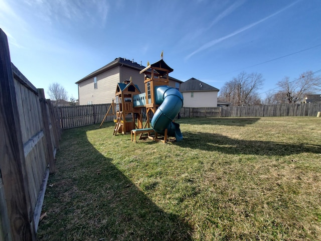 view of yard featuring a playground and a fenced backyard