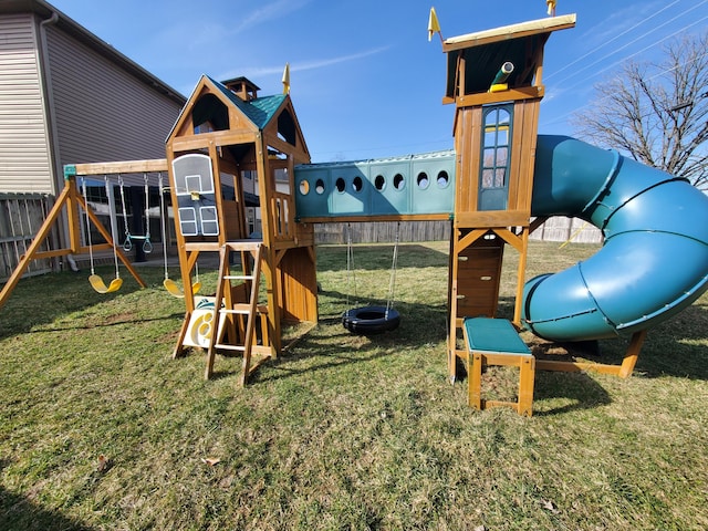 view of play area with a lawn and fence