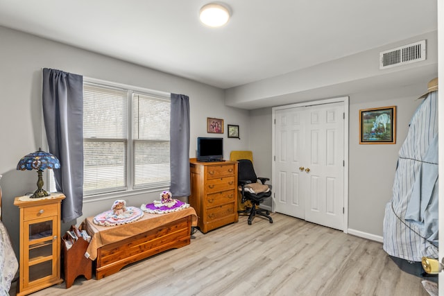 office with visible vents, baseboards, and wood finished floors