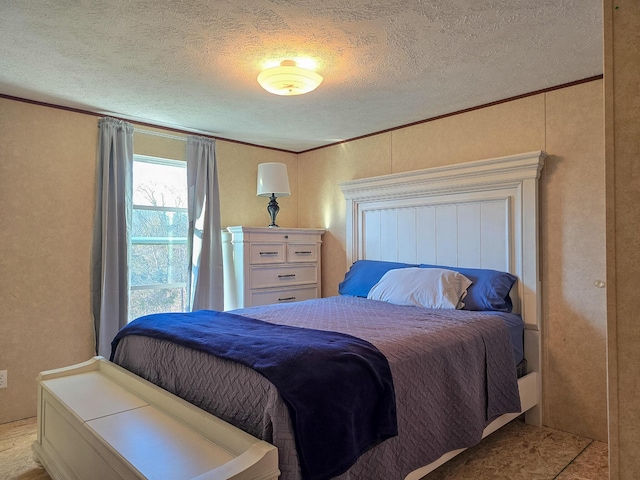 bedroom with crown molding and a textured ceiling