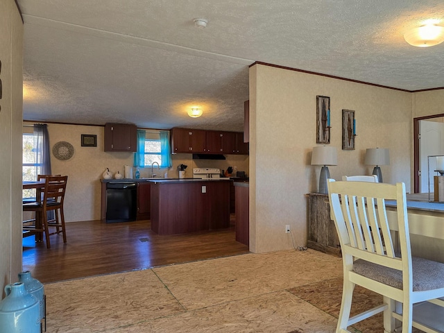 kitchen featuring a center island, black dishwasher, a sink, and a textured ceiling