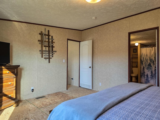 bedroom with a textured ceiling, visible vents, and crown molding