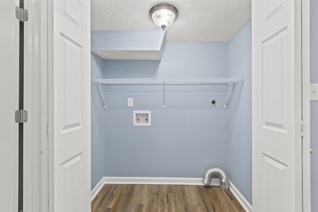 clothes washing area featuring baseboards, dark wood-style flooring, hookup for a washing machine, a textured ceiling, and hookup for an electric dryer