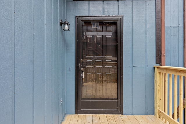 doorway to property featuring board and batten siding