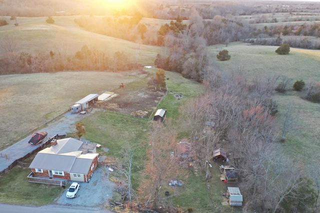 birds eye view of property with a rural view