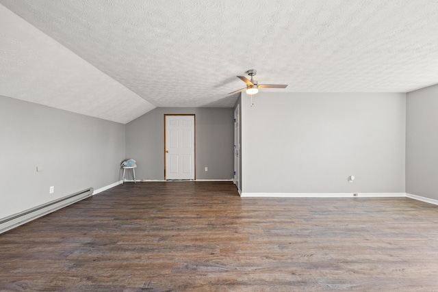 additional living space featuring lofted ceiling, a textured ceiling, a baseboard radiator, and wood finished floors