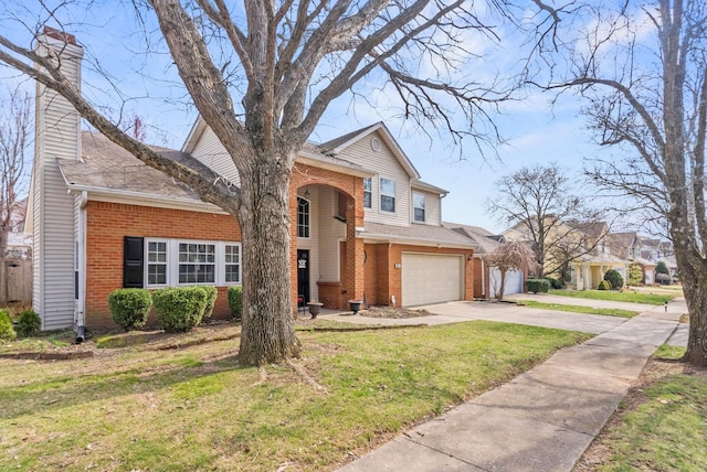 traditional home featuring a front yard, a garage, brick siding, and driveway