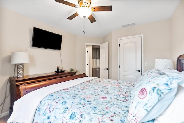 bedroom with visible vents and a ceiling fan