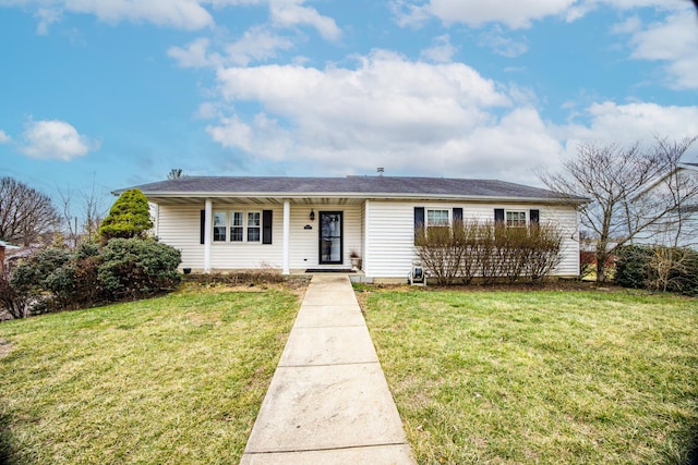 ranch-style home featuring covered porch and a front yard