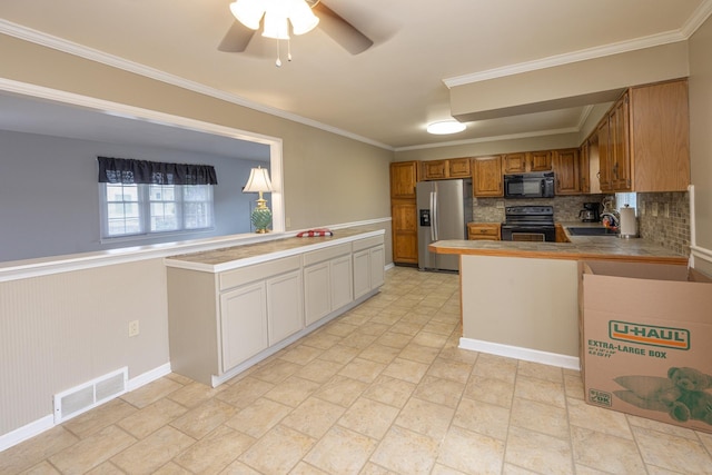 kitchen featuring visible vents, electric stove, stainless steel fridge with ice dispenser, a peninsula, and black microwave