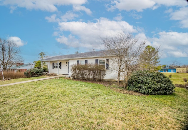 single story home featuring a front yard