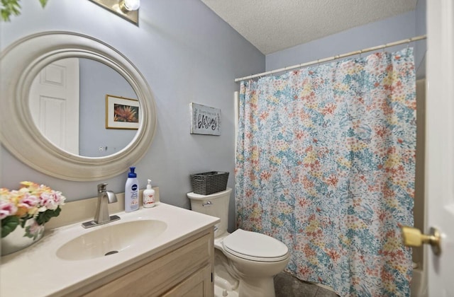 full bathroom featuring curtained shower, toilet, a textured ceiling, vanity, and tile patterned flooring