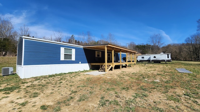 exterior space featuring cooling unit and a wooden deck