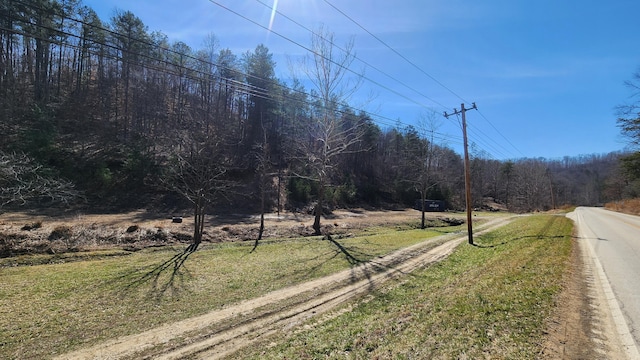 view of road featuring a view of trees