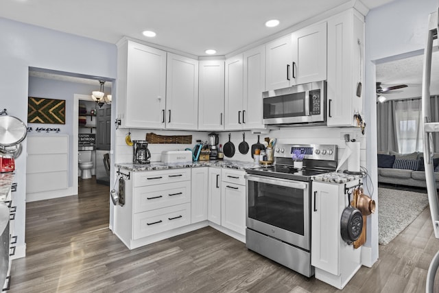 4200 Grays Run Pike, Cynthiana, KY 41031 - kitchen featuring light stone counters, stainless steel appliances, dark wood-style floors, and white cabinetry