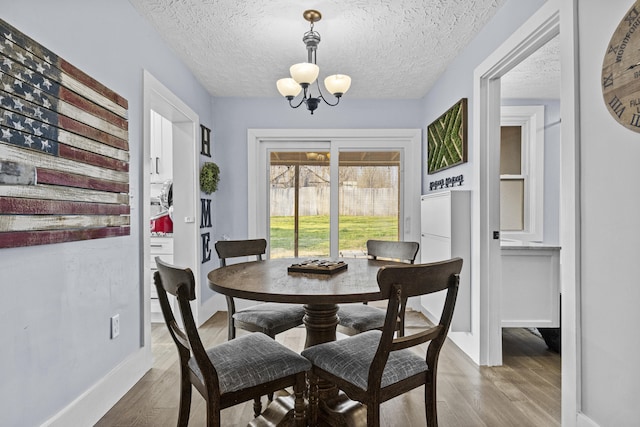 4200 Grays Run Pike, Cynthiana, KY 41031 - dining area with a chandelier, baseboards, a textured ceiling, and wood finished floors