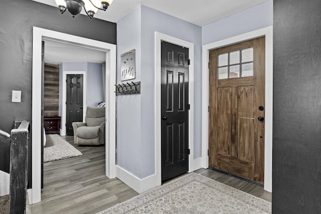 4200 Grays Run Pike, Cynthiana, KY 41031 - foyer entrance featuring an inviting chandelier, baseboards, and wood finished floors