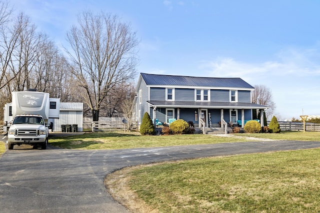 4200 Grays Run Pike, Cynthiana, KY 41031 - view of front facade with covered porch, metal roof, a front yard, and fence
