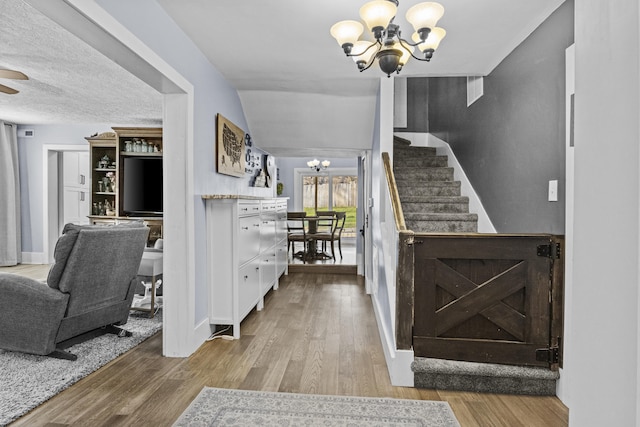 4200 Grays Run Pike, Cynthiana, KY 41031 - entryway featuring a notable chandelier, stairs, baseboards, and wood finished floors
