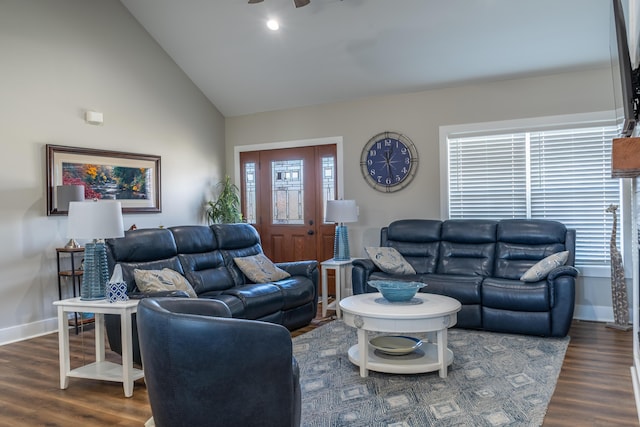 living room with high vaulted ceiling, baseboards, and wood finished floors