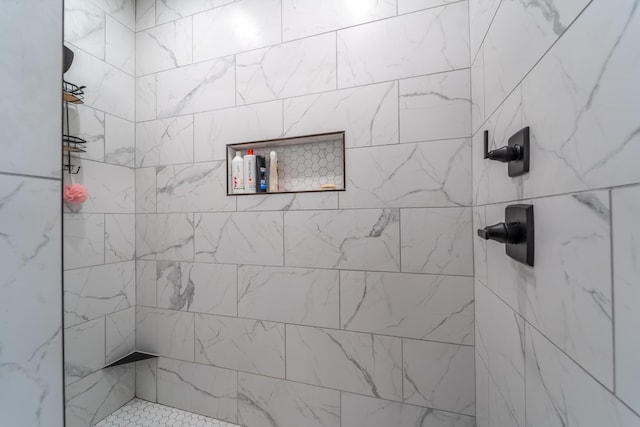 full bathroom with tiled shower