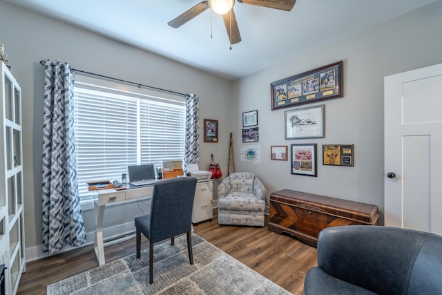 office area featuring a ceiling fan, baseboards, and wood finished floors