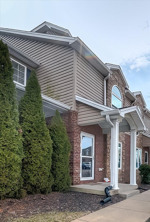 view of home's exterior featuring brick siding