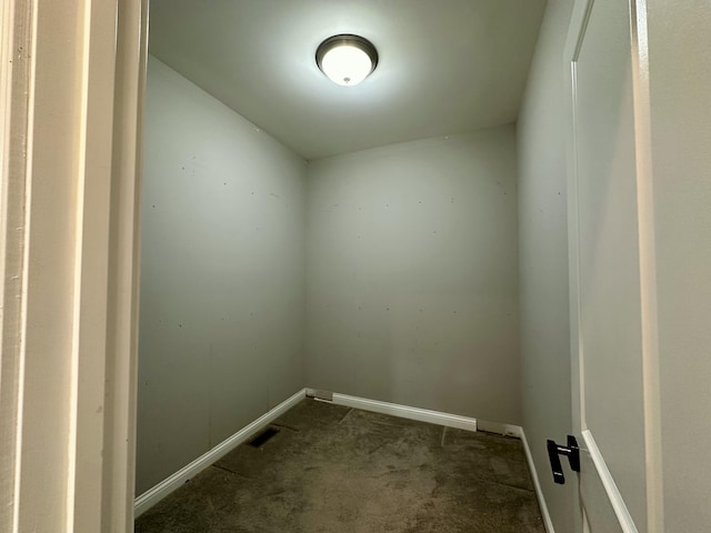 carpeted spare room with baseboards