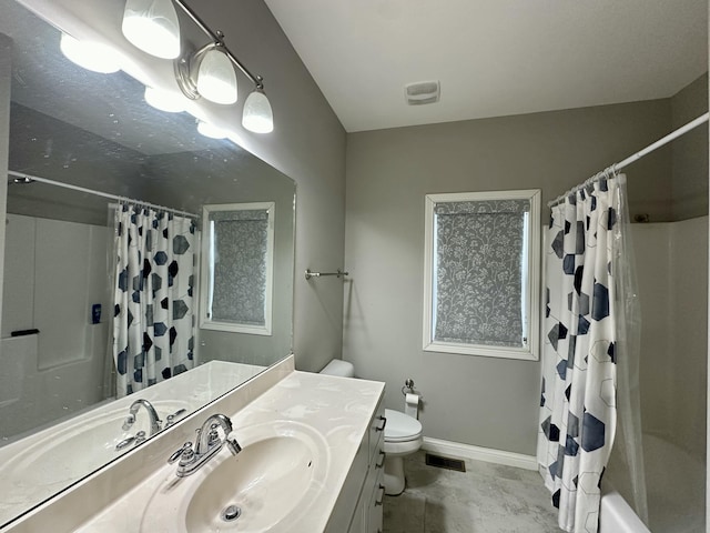 full bathroom featuring toilet, baseboards, visible vents, and vanity