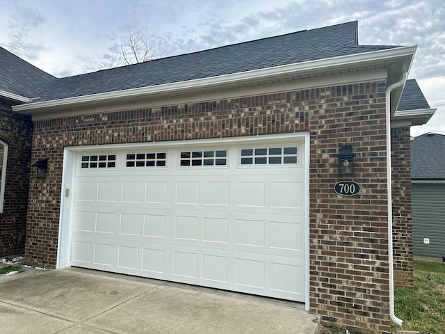 garage with concrete driveway