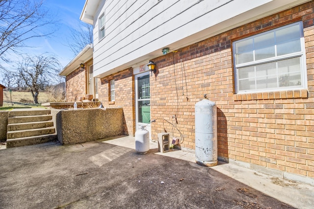 view of property exterior with brick siding