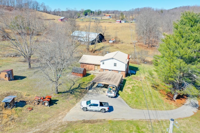 birds eye view of property with a rural view