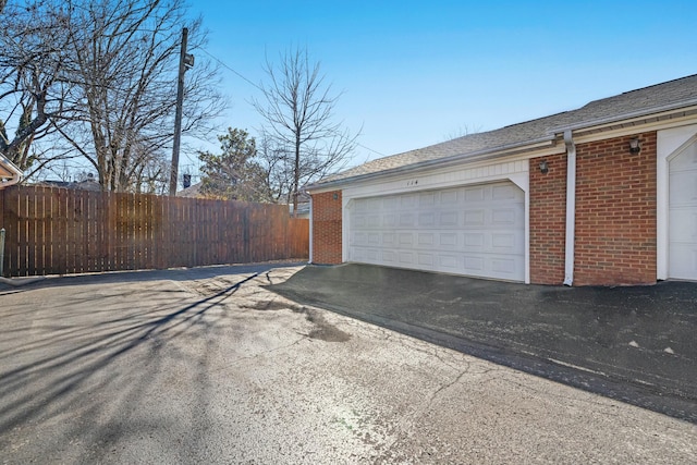 garage with fence