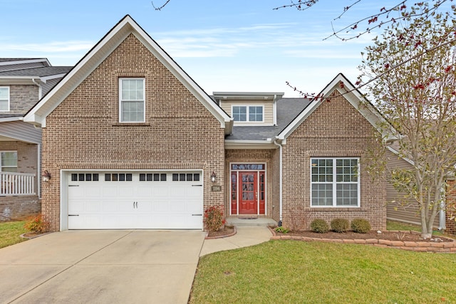 traditional-style home featuring a garage, brick siding, a shingled roof, concrete driveway, and a front yard