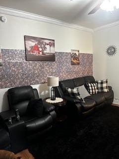 living room featuring a ceiling fan and crown molding