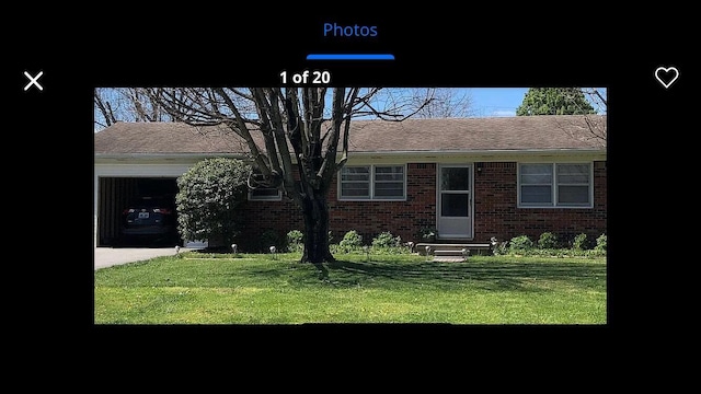 single story home with brick siding, a front yard, and entry steps