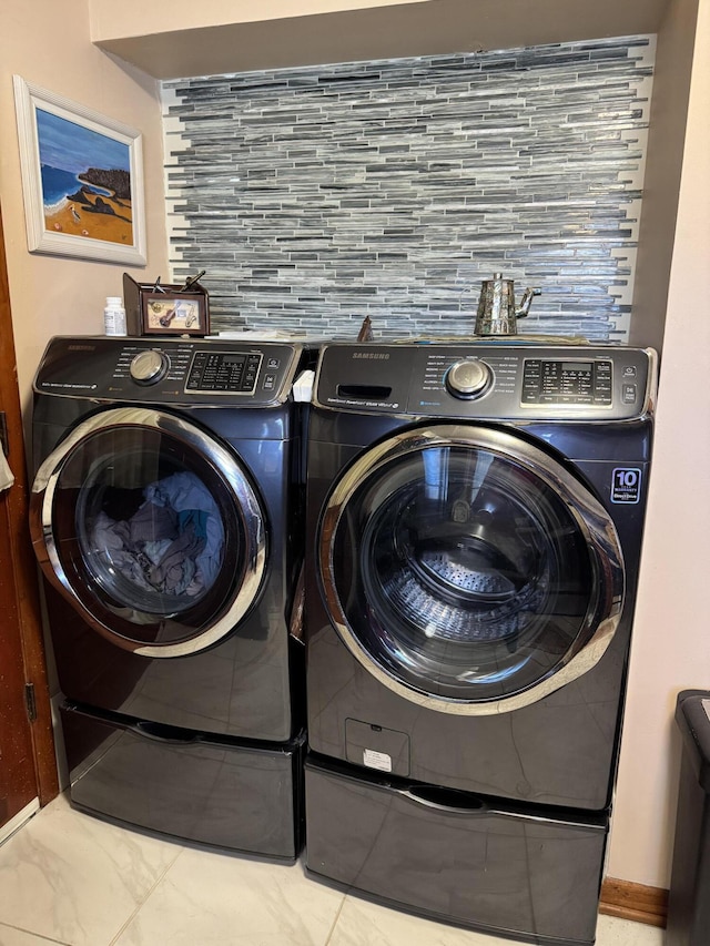 laundry area featuring laundry area and washing machine and clothes dryer